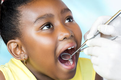 young girl having her teeth checked during a dental appointment