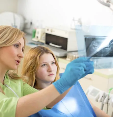 patient being shown her dental x-rays