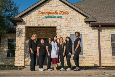 The Sunnyvale Kids Pediatric Dentistry team in front of their office in Sunnyvale, TX