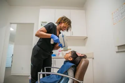 LaTonya of Sunnyvale Kids Pediatric Dentistry taking dental X-rays of a patient